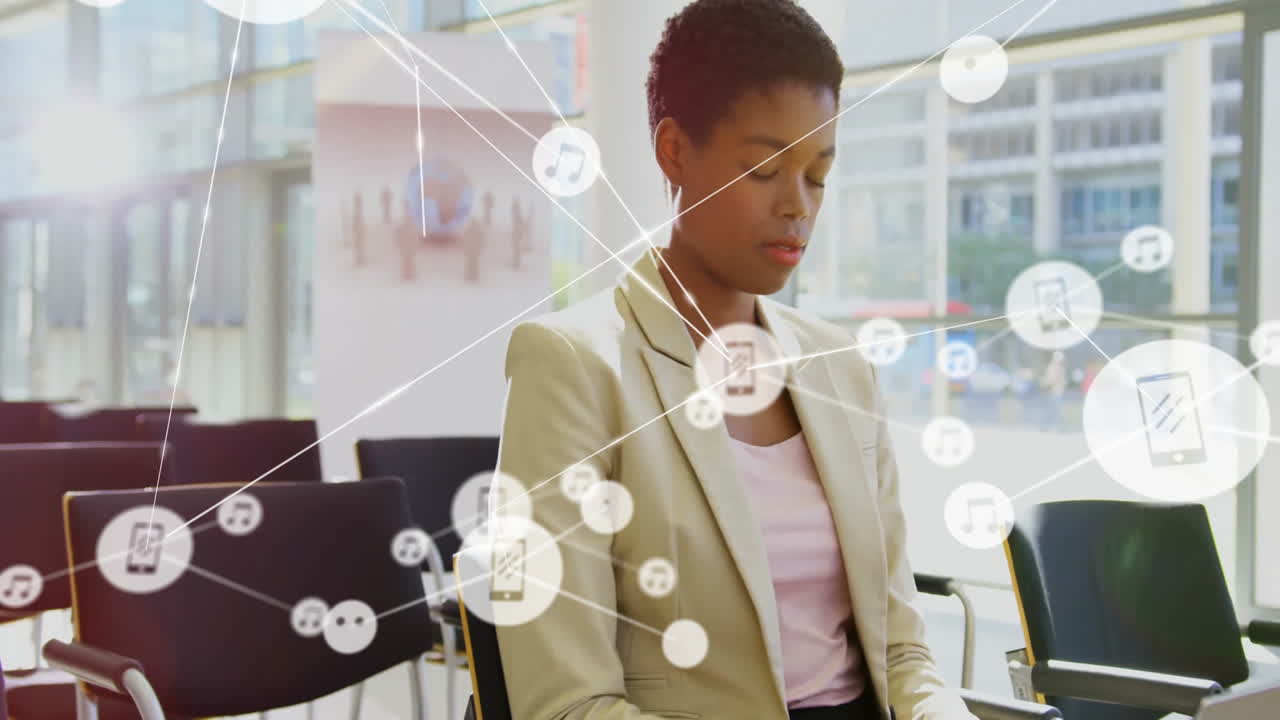 In office, businesswoman using animation of digital network with music icons