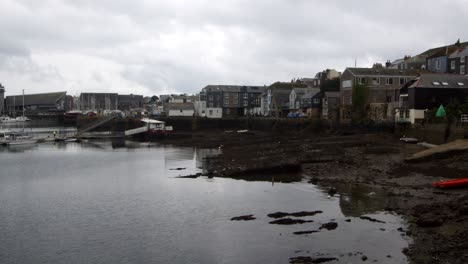 wide shot of buildings on falmouth harbour with the tied out