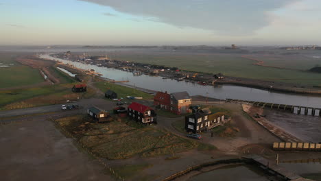 Drone-footage-of-Walberswick-harbour,-suffolk-in-early-morning-mist