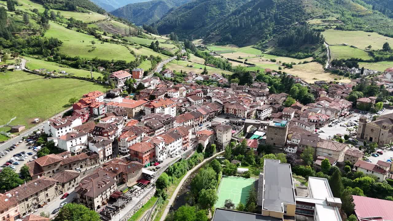 Aerial View of a Picturesque Town in a Green Mountain Valley
