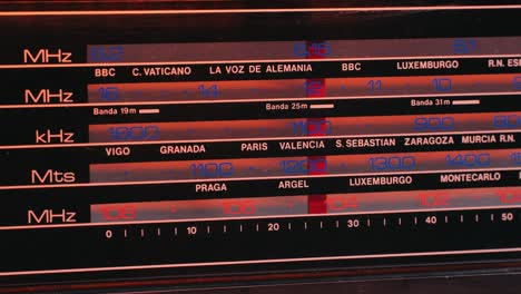 old retro am fm radio with tubes, hand changing stations , bulb vintage music player.