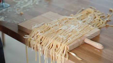 Sprinkle-flour-over-freshly-made-pasta-to-prevent-the-noodles-from-sticking-together