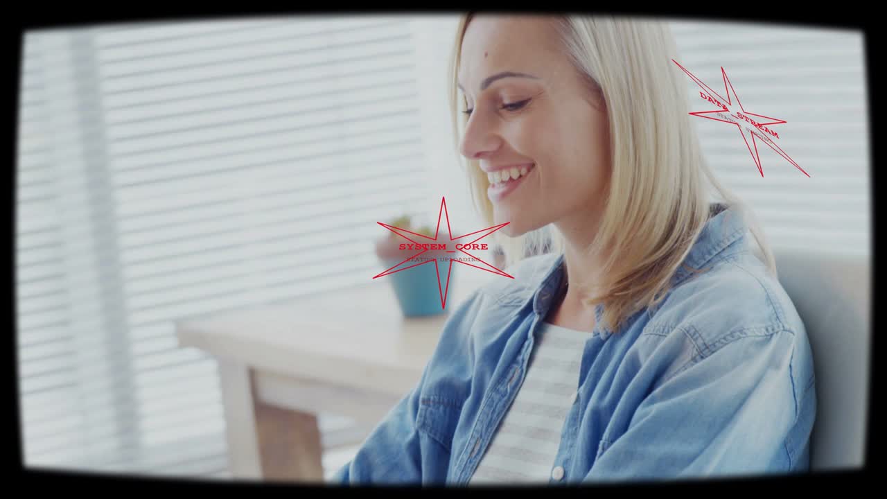 Woman typing on laptop, initiating camera push, red data overlay aligning face for technology work
