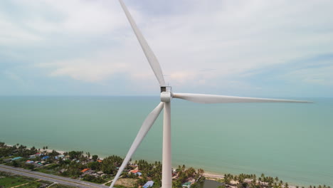 Green-Energy,-Wind-Turbine-produce-Energy-on-the-Tropical-Coast,-Modern-Power-Plant-Alternative-Renewable-Energy-Sources