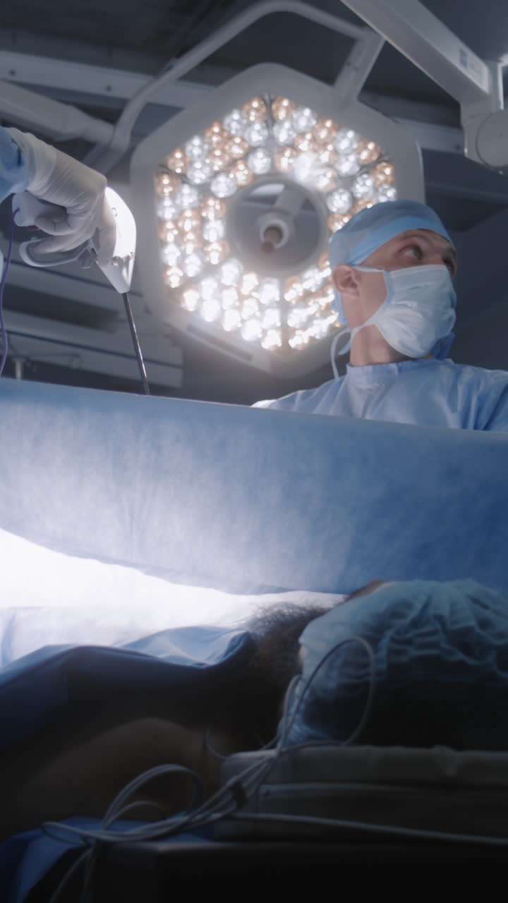 Male surgeon operates patient with colleagues 4k 2025 07 24 07 04 49 utc.mov | anesthesiology, clinic, emergency, equipment