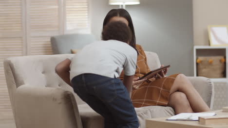 mother and son using tablet together