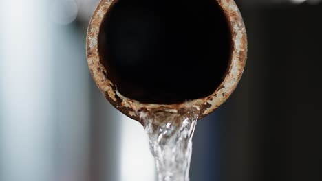 water flowing from rusty pipe