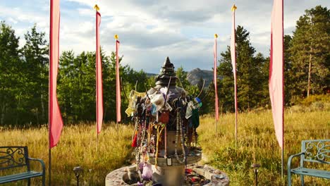 fountain covered in offerings at the stupa in red feather lakes, co