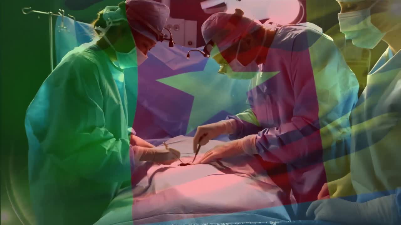 animación de la bandera de camerún ondeando sobre los cirujanos en el quirófano