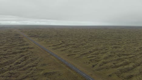 aerial shot of a moss covered lava field in iceland