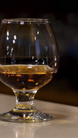 pouring cognac into a glass