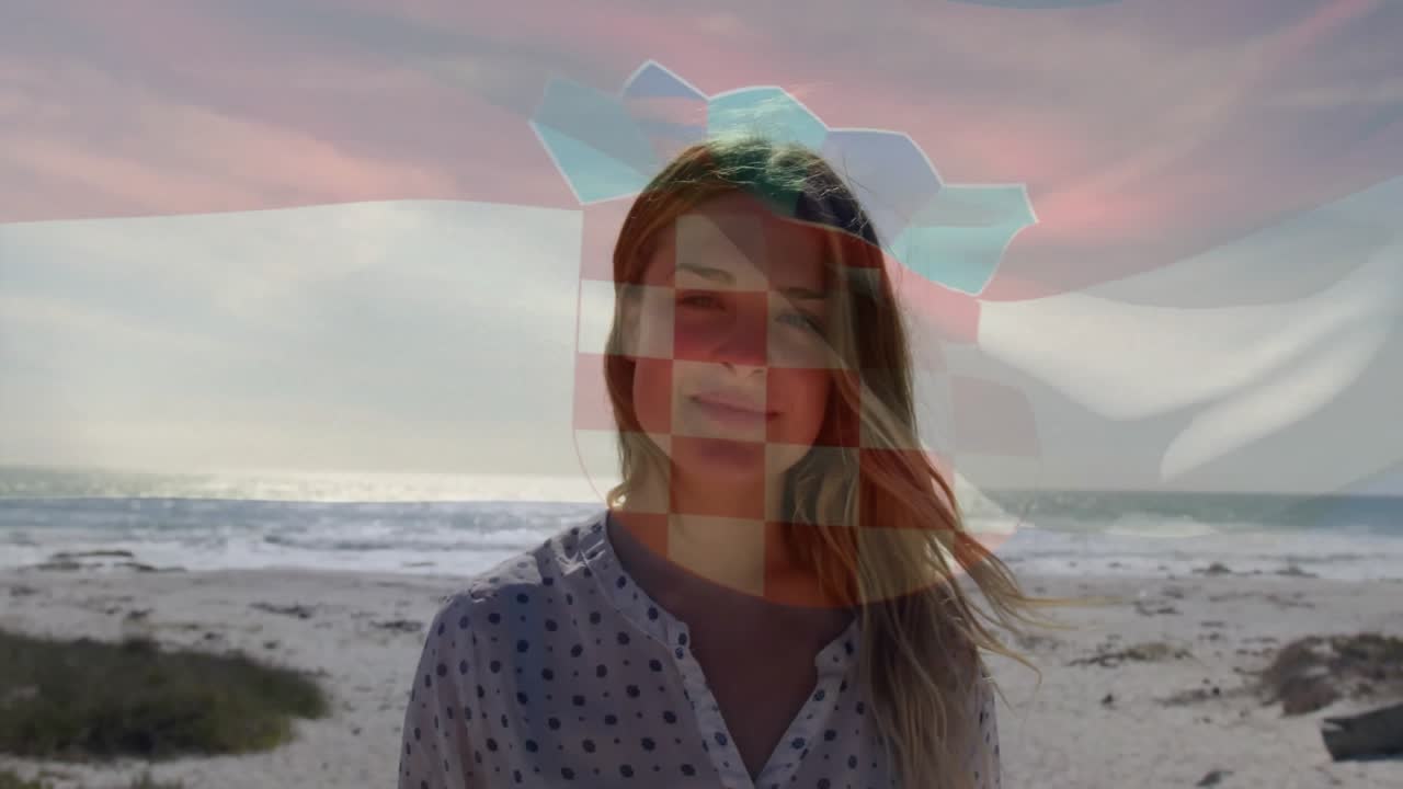 Animation of flag of croatia over happy caucasian woman at beach