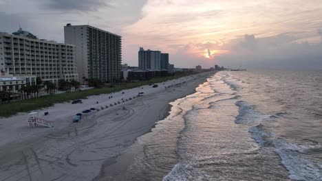 fast aerial pullout north myrtle beach, sc, south carolina at sunrise over the surf