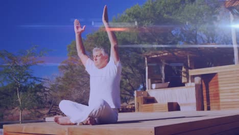 Animation-Von-Lichtflecken-über-Einem-älteren-Kaukasischen-Mann,-Der-Yoga-Praktiziert-Und-Meditiert
