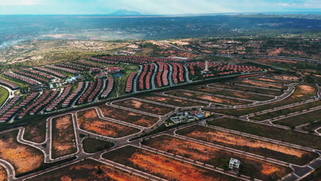 Aerial-view-of-beach-resort-town-of-Mui-Ne,-south-east-asia-Vietnam-development-tourist-villas-and-resort-near-the-natural-sand-dunes-Real-estate-development