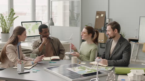 businesswoman explaining wind turbine model during a meeting in the office 1