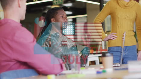 animation of flag of usa over diverse business people in office