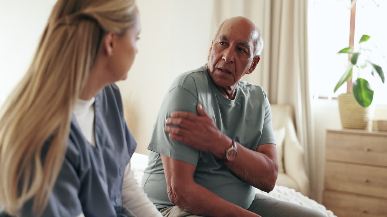 Nurse talking with elderly patient