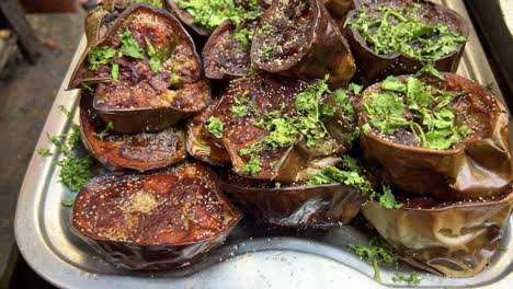 bengali style begun bhaja - vegetarian recipe of shallow-fried eggplant disks.