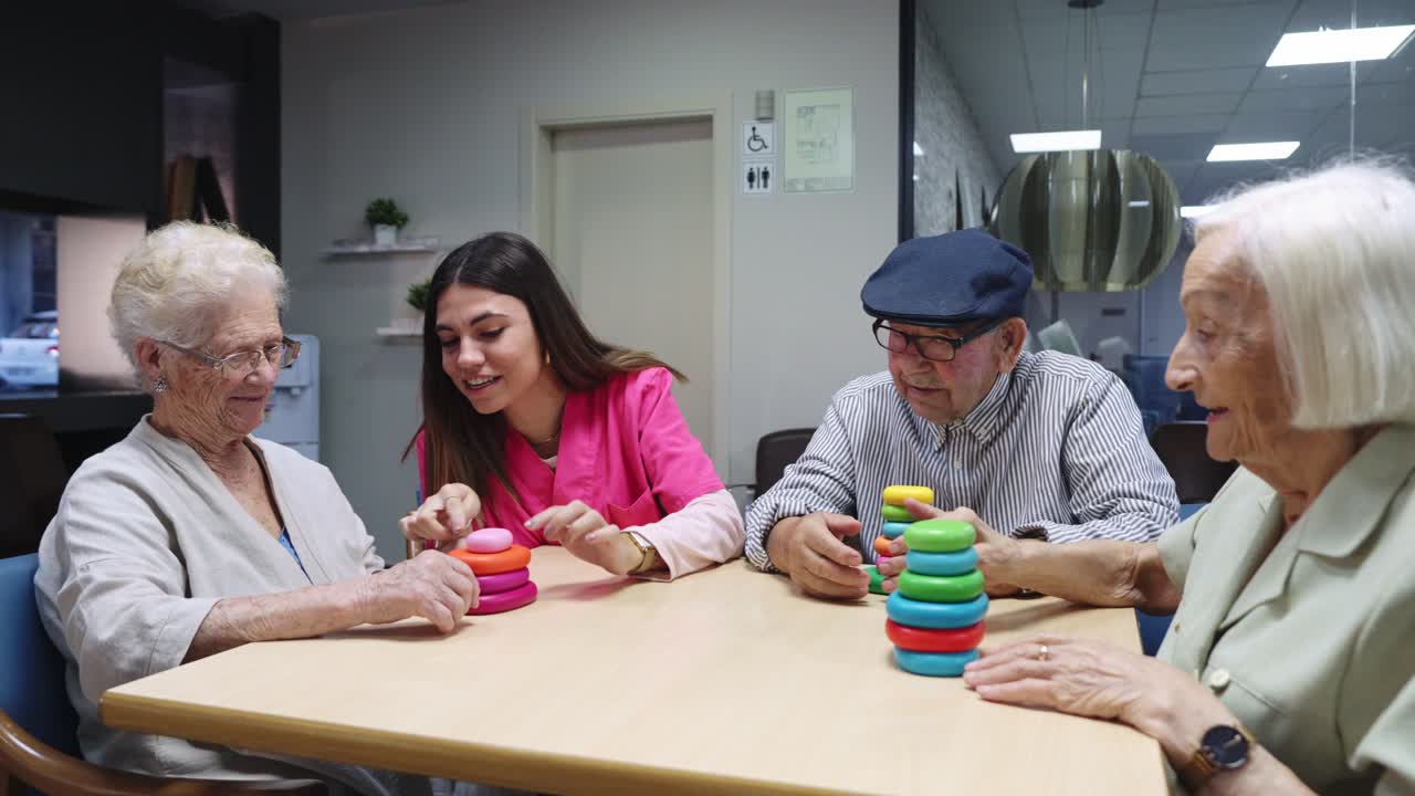 Seniors playing a game with a nurse