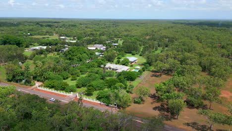 large rural estate with tall brick fence aerial drone