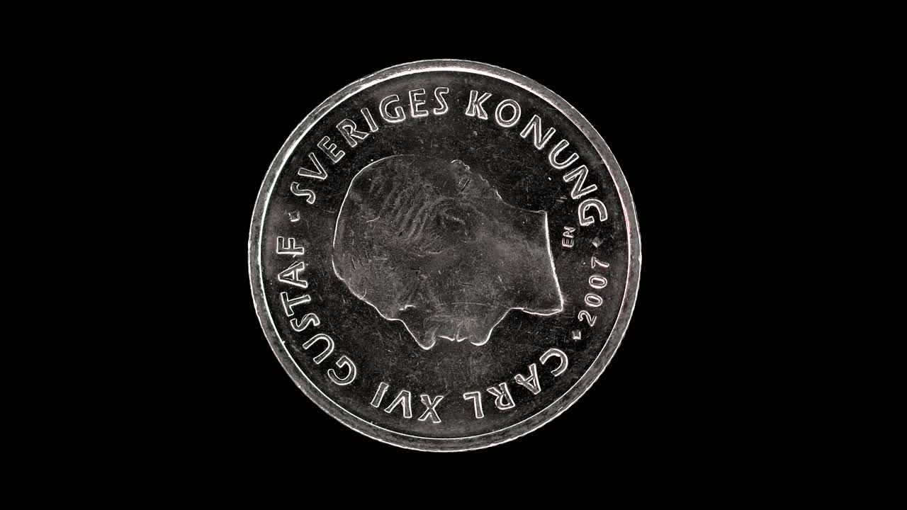 Sweden 2007 1 krona coin obverse with portrait of Carl XVI Gustaf rotating on black background