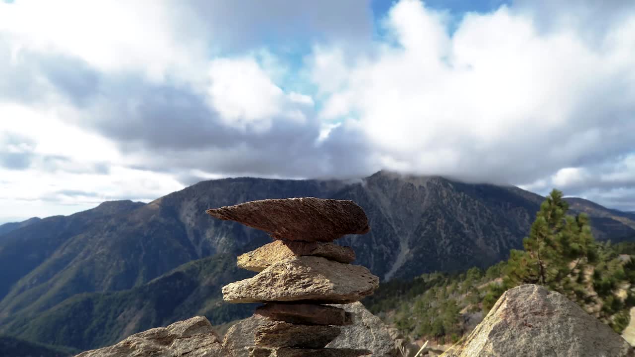 Rock formation in foreground during a timelapse sequence with mountain in the background