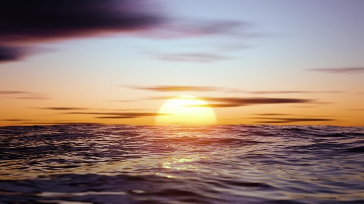 Big hot sun in the reflection of the sea over the horizon. Infinitely looped animation.