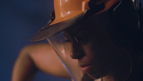 female worker in protective gear