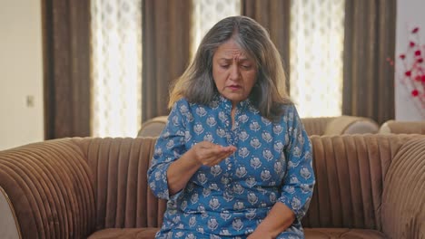 Aged-Indian-woman-suffering-from-hair-loss-problem