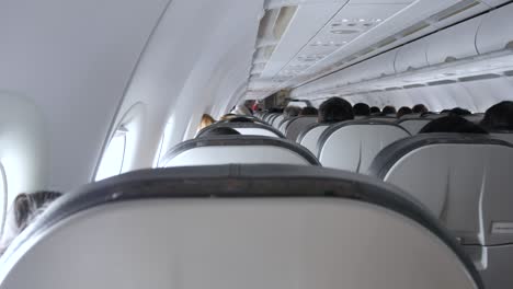 pov of the seat in the airplane cabin economy class