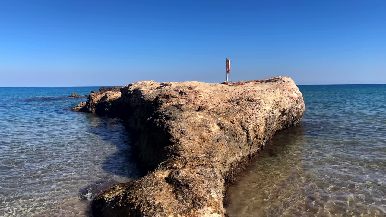 Close up of fun rock separating beaches in crete greece