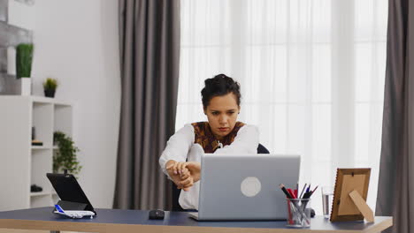 Tired-business-woman-stretching-her-back