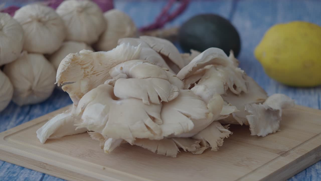 Fresh Mushrooms and Garlic on a Cutting Board
