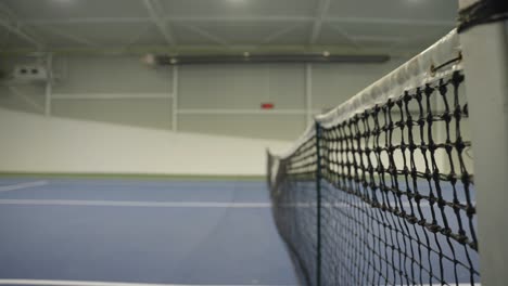 tennis ball hitting the net