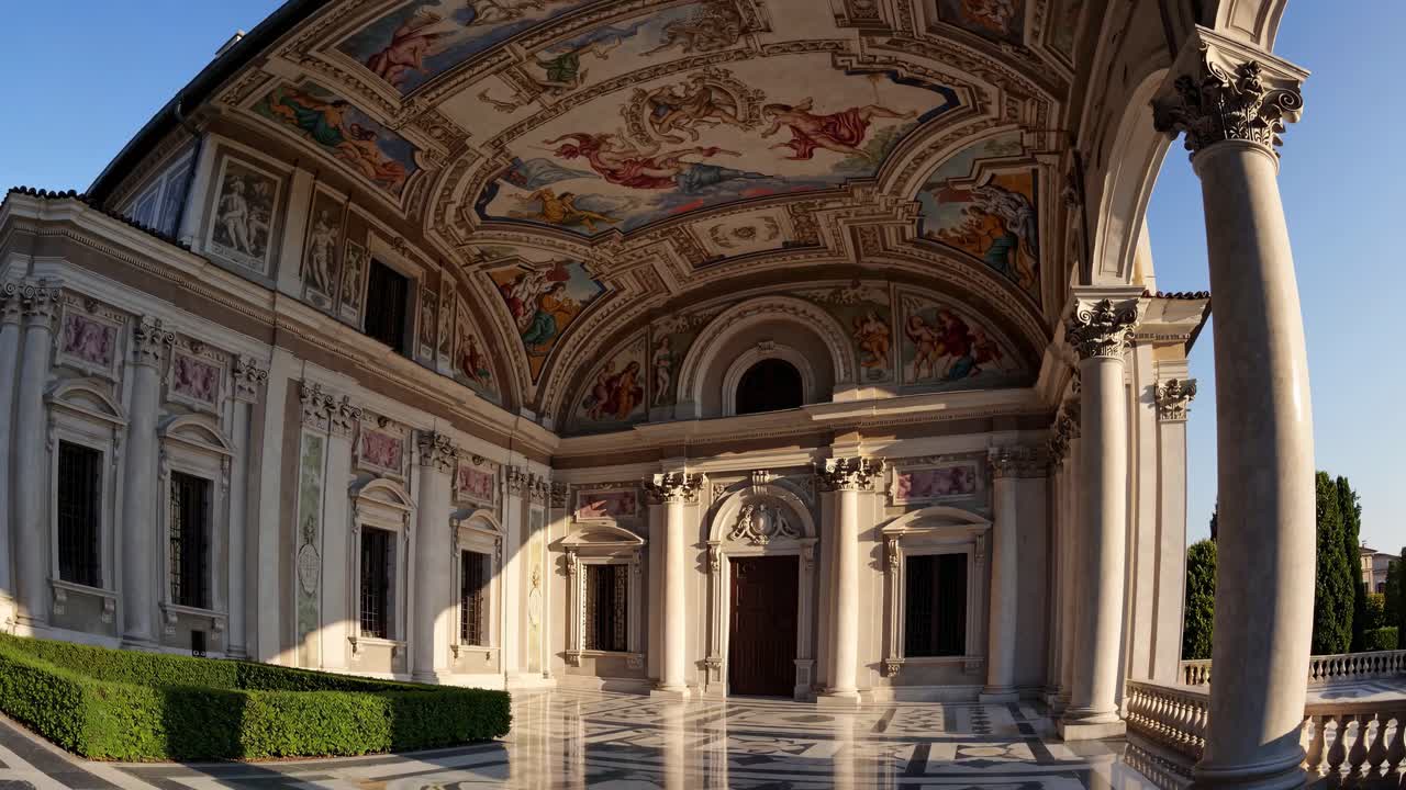 Wide-angle video captures ornate Renaissance architecture with detailed frescoes on a grand arched