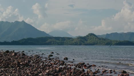 seascape with mountain in the background