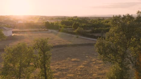 aerial establishing shot of rural remote road in spain at sunset