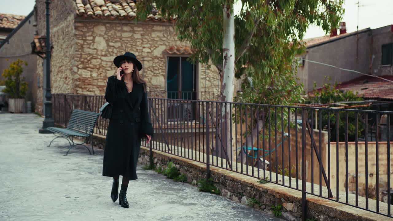 Elegant Woman Having A Business Call In The Streets Of A Small Town