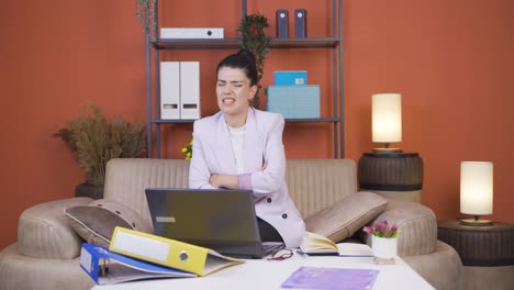the young woman working from home gets angry, feels offended and sad.