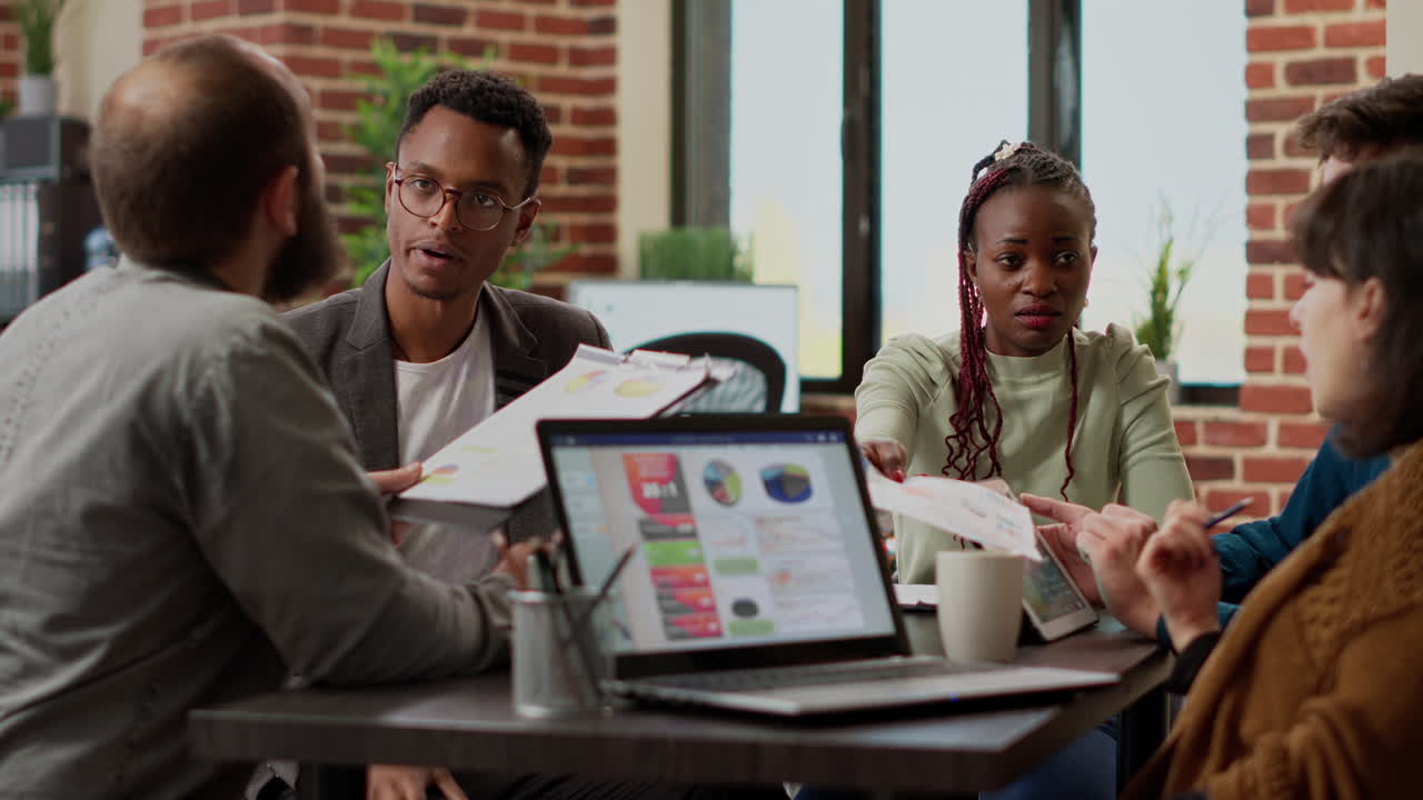 Diverse team of coworkers analyzing research information