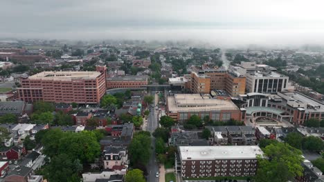 foggy morning in a small city smoke rises