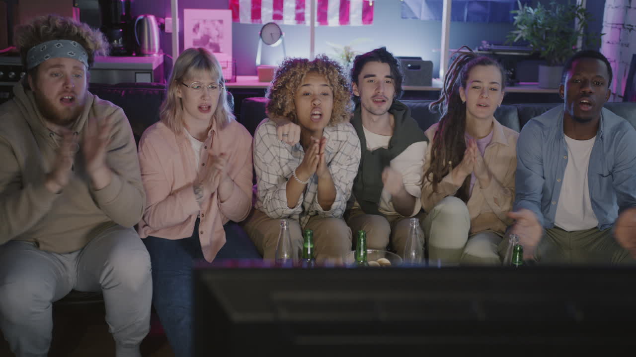 Friends Watching TV and Celebrating