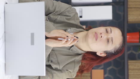 Vertical-video-of-Nervous-and-stressed-business-woman-is-thinking.