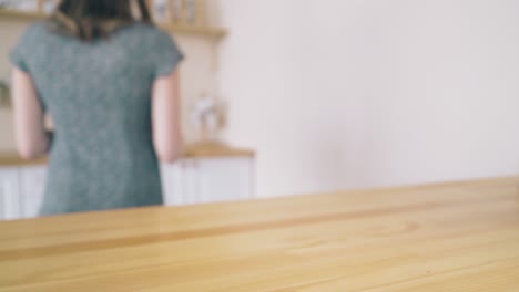 happy lady with homemade bread in wicker basket on table