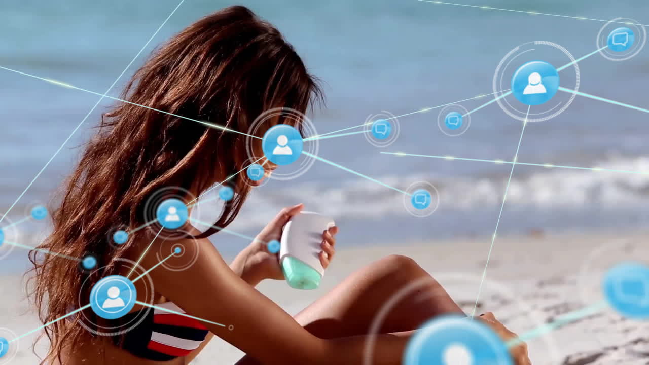 Animation of connected profile icons over biracial girl applying lotion before sunbath at beach