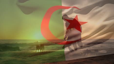 animation of flag of algeria over caucasian man with dogs at beach