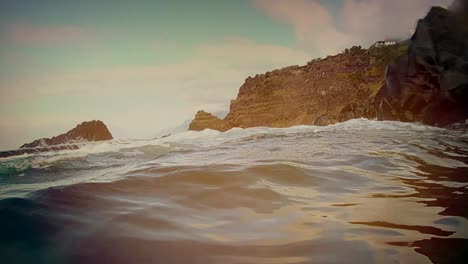 Stylish-moody-warm-lens-flare-POV-seascape-scene-Wave-break-crash-close-up-POV-underwater-view-tidal-and-thermal-gradient-alternative-energy-oxygen-CO2-bubbles-marine-life-preservation-fisheries