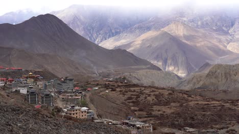 a panning view of the town of muktinath in the muktinath valley of the mustang region of northern nepal