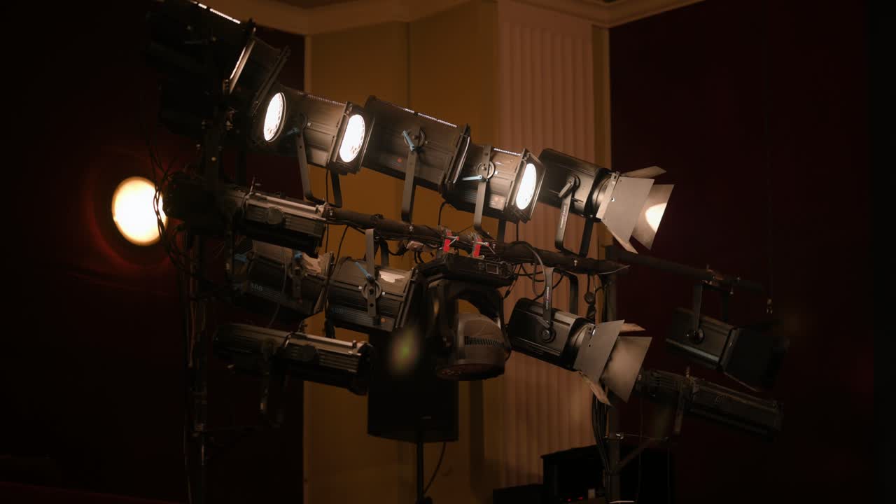 Static shot with theater stage lights, white light, handheld